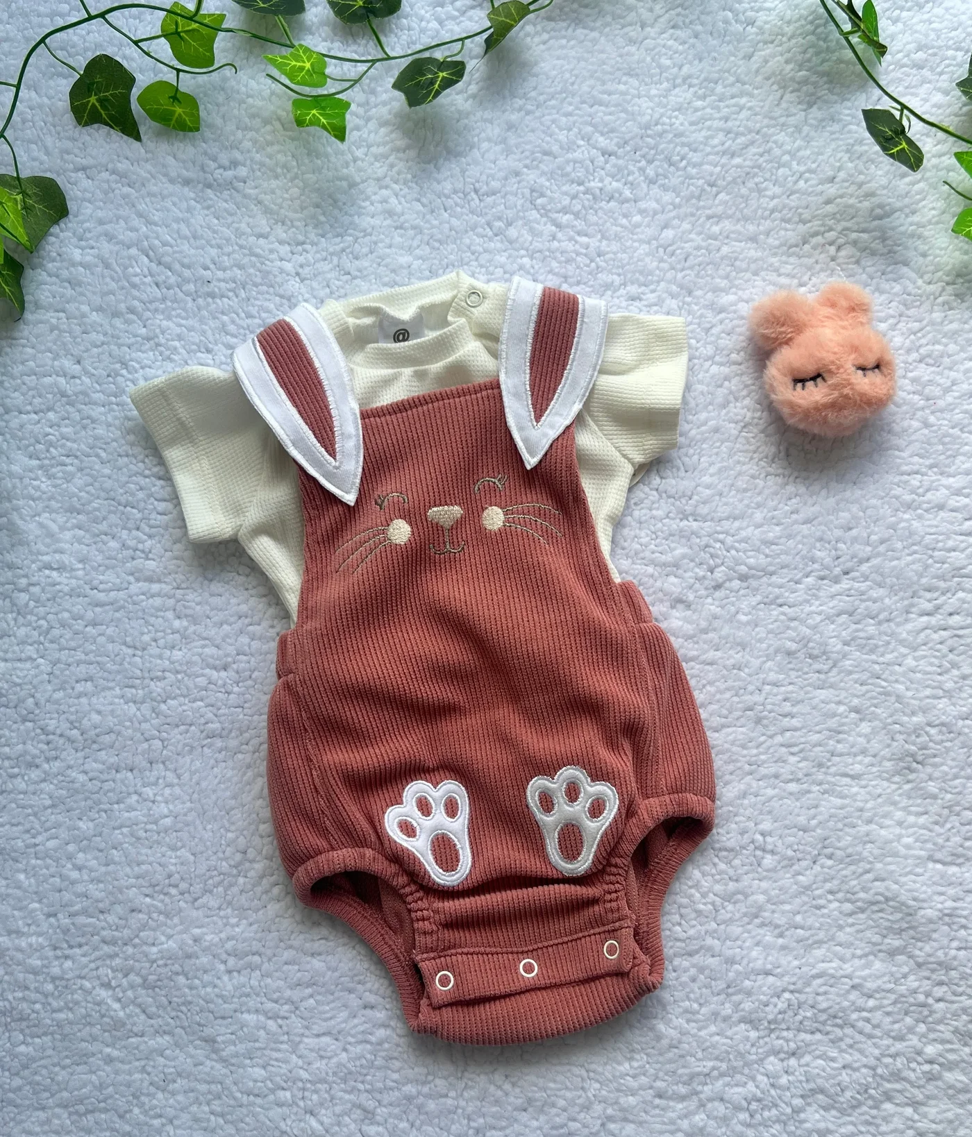 conjunto-asoleador-rosado-de-paticas_babyrex_01_837af816.webp