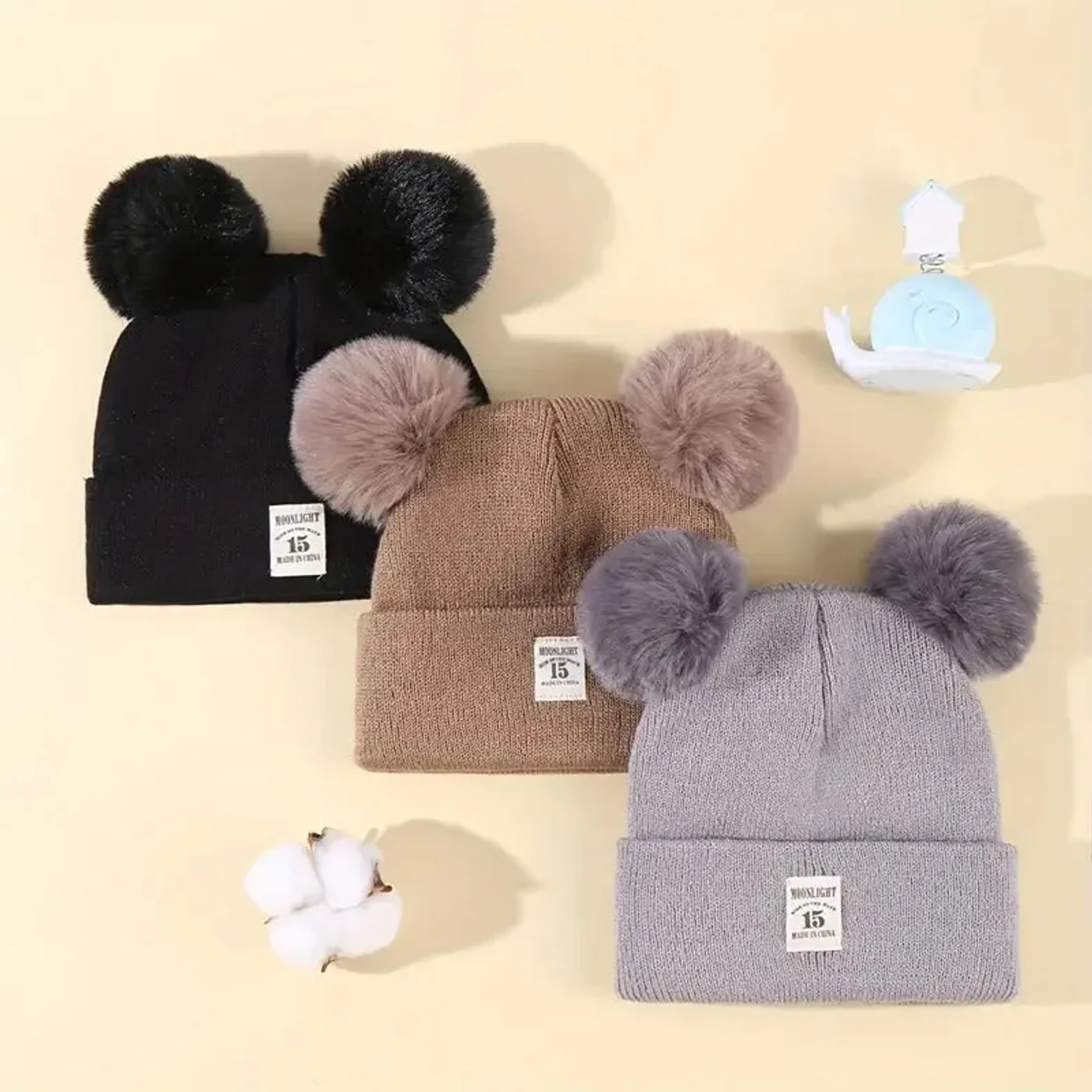 gorro-con-pompones-abrigador-rosado-gris-cafe-negro-para-bebe_babyrex_02_f680559d.webp